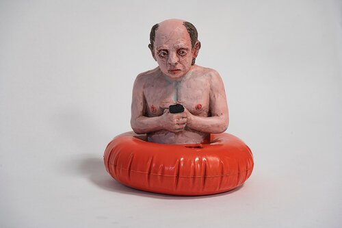 Waiting for cllimate change by artist Isaac Cordal